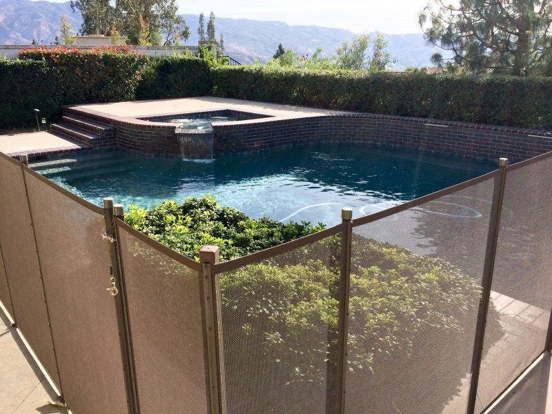 Pool with Mesh Fence Barrier